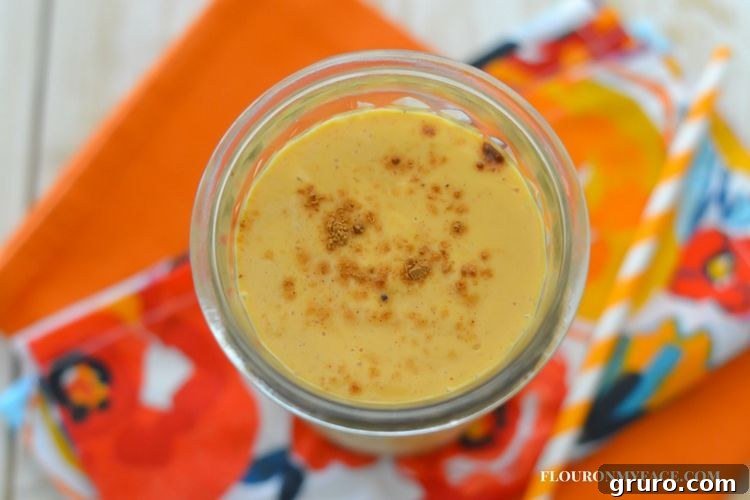 Monday Fall Ideas and Inspiration 7 Pumpkin Smoothie Recipe in a glass with a straw