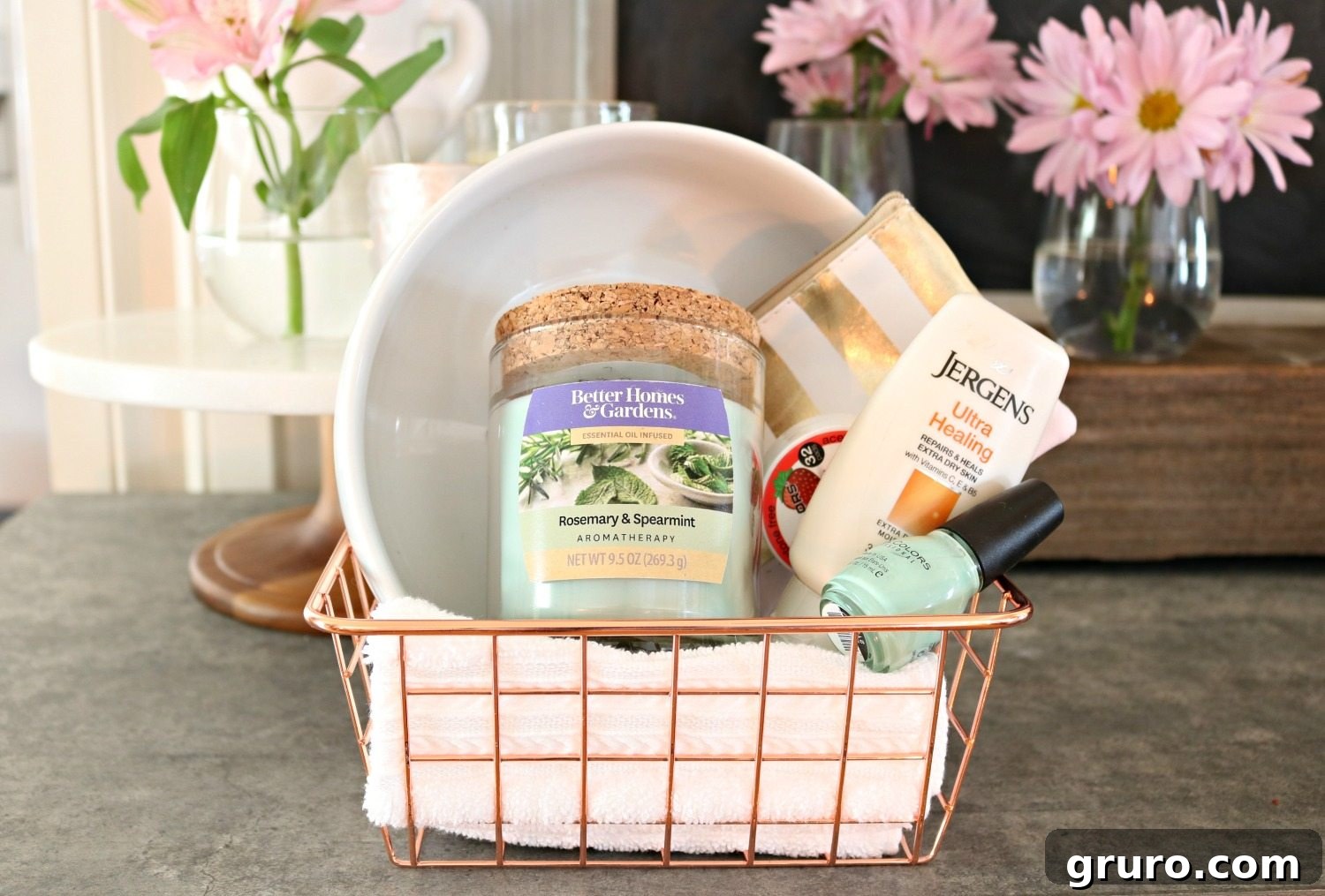 Stylish spa basket filled with nail care essentials and an aromatherapy candle, perfect for a relaxing friends' night in.