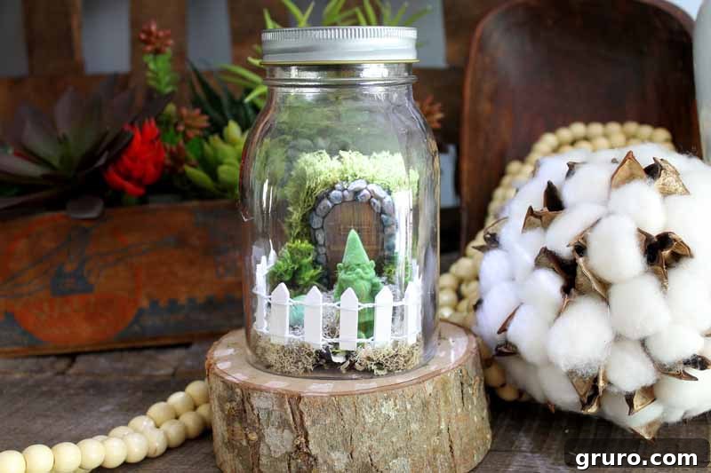 Handcrafted mini fairy garden with small plants and whimsical accessories