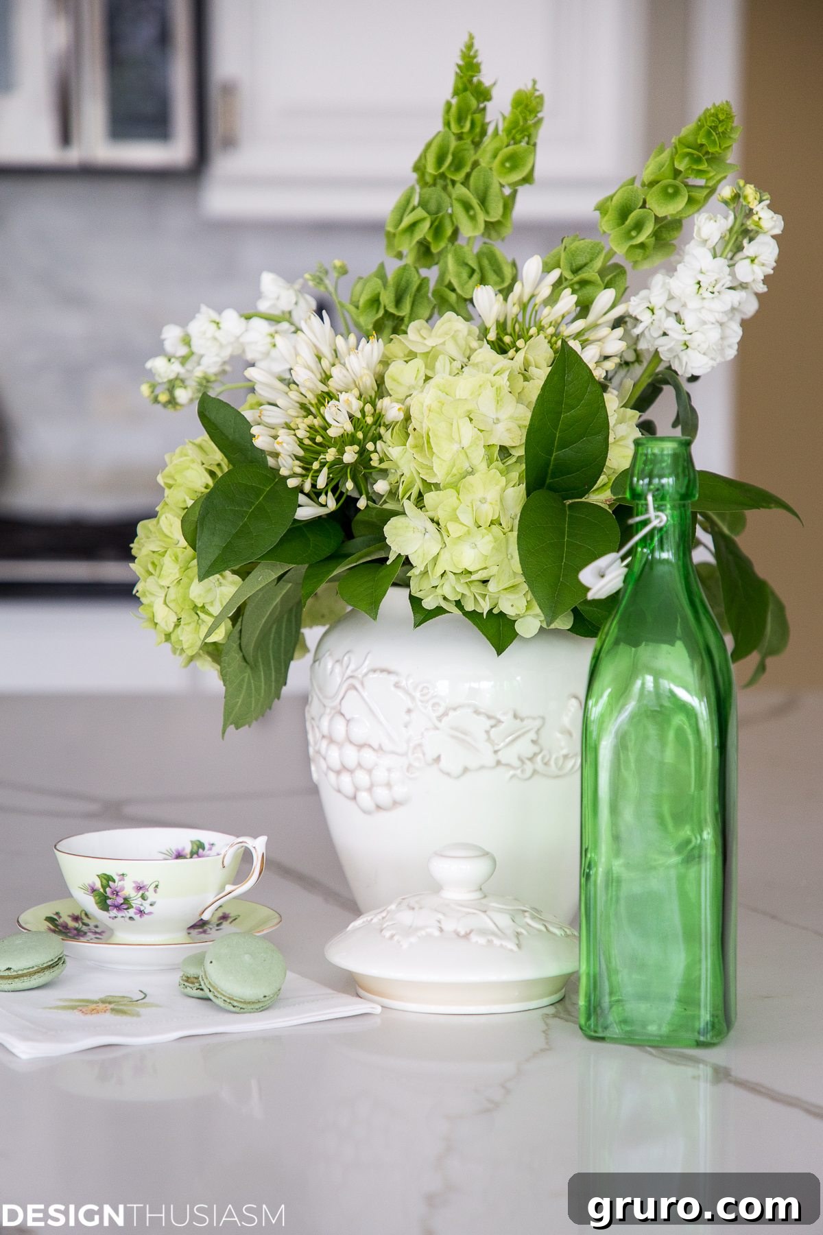 Elegant spring green floral arrangement with white hydrangeas and eucalyptus