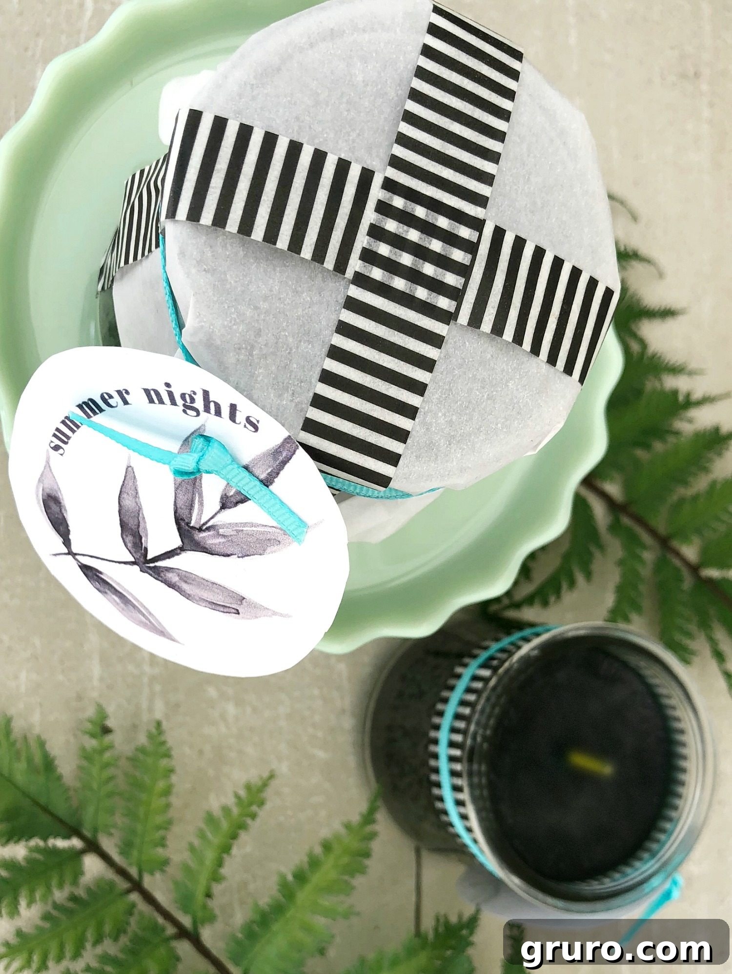 Creative homemade candle packaging using wax paper, ribbon, and a custom printable label