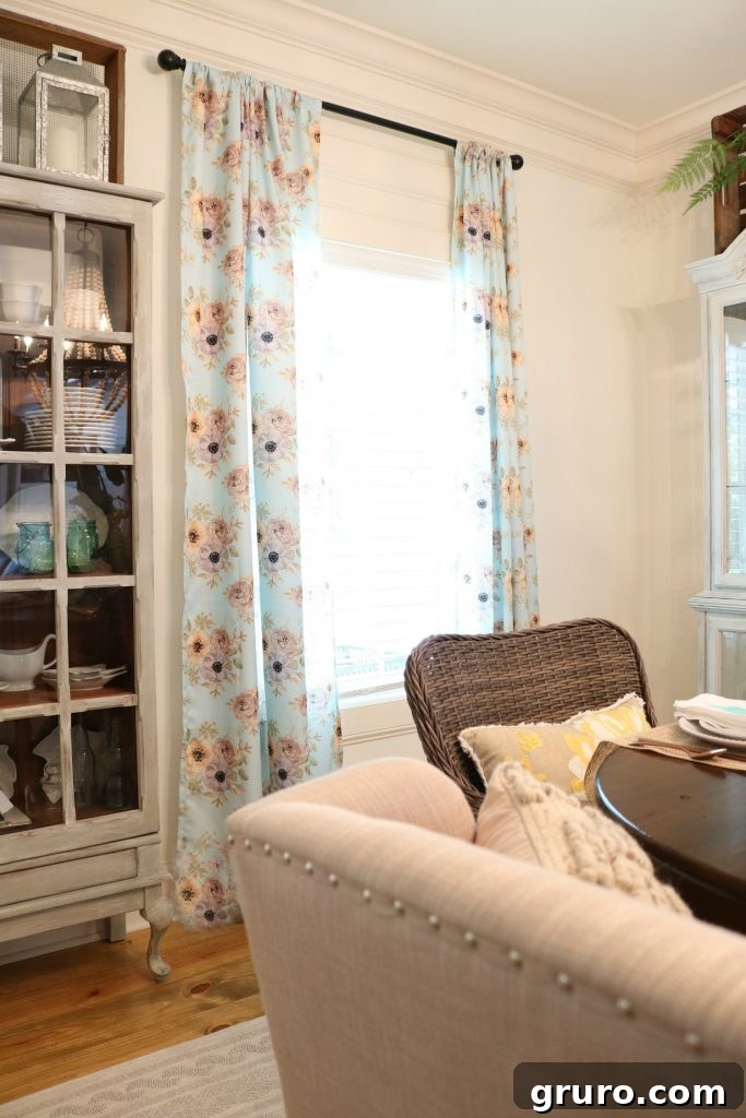 Close-up of blue floral curtains in a dining room