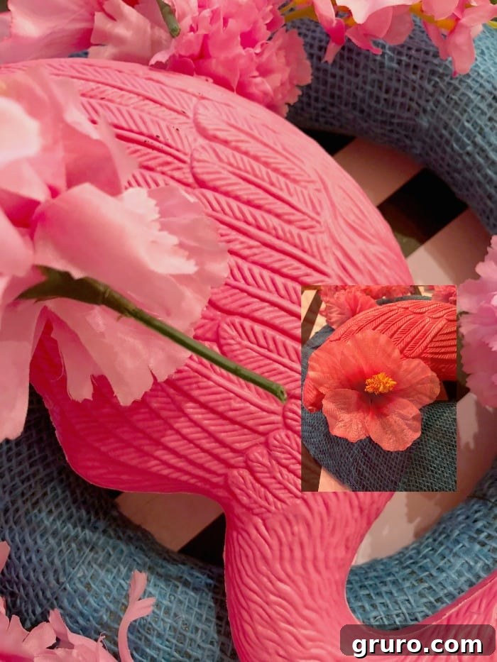 Close-up of artificial flowers being cut with wire cutters for wreath embellishment