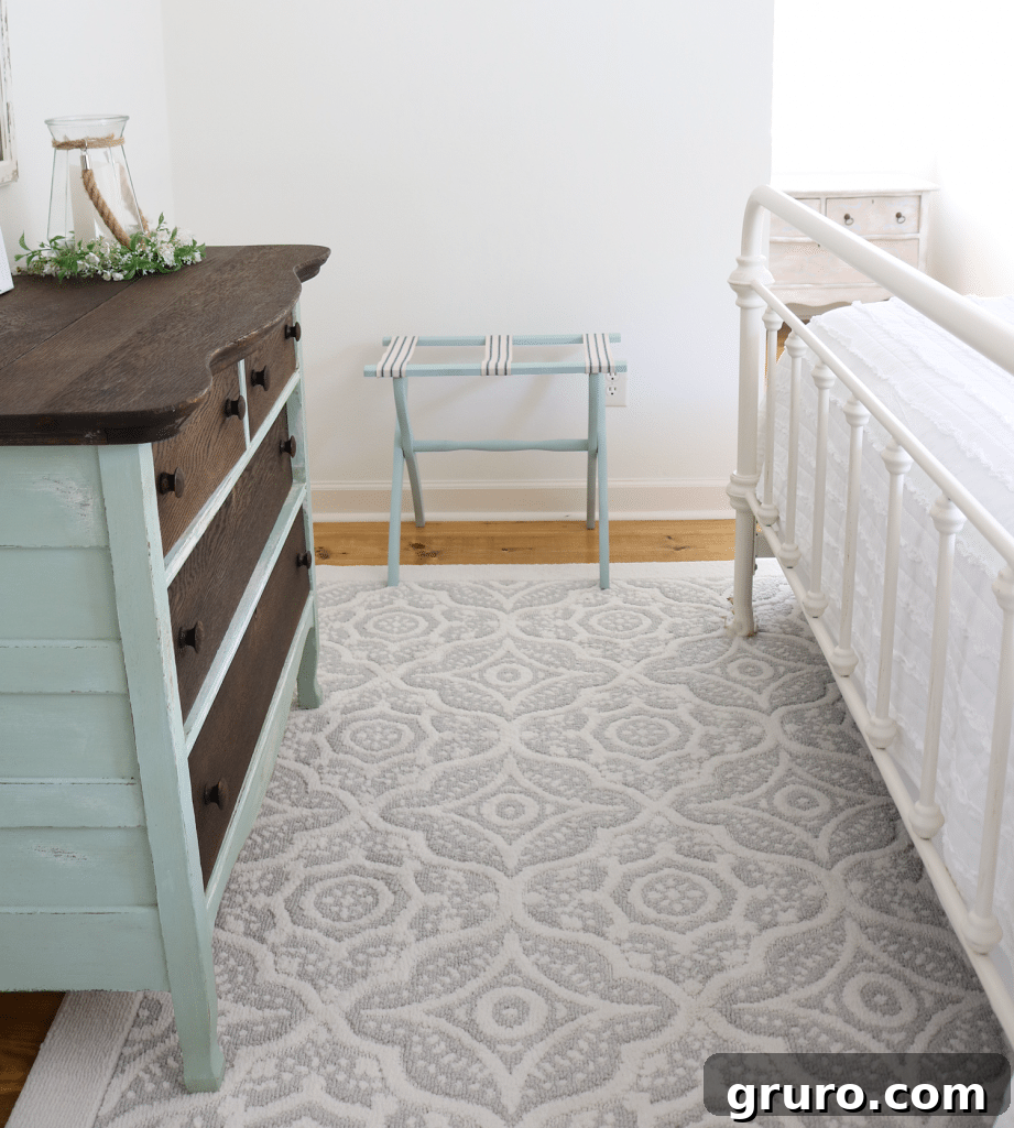 Close-up of the cozy and textured Better Homes & Gardens area rug, adding warmth to the guest bedroom
