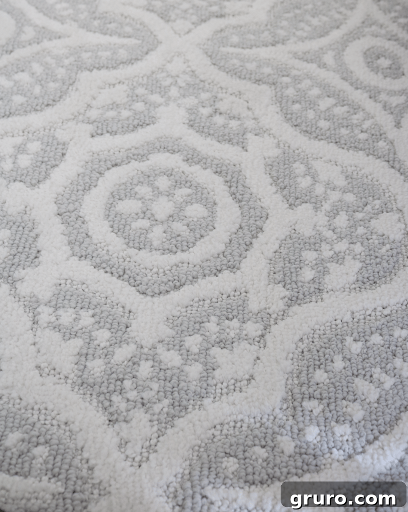 Detailed texture of the Better Homes & Gardens area rug for the guest room, highlighting its softness
