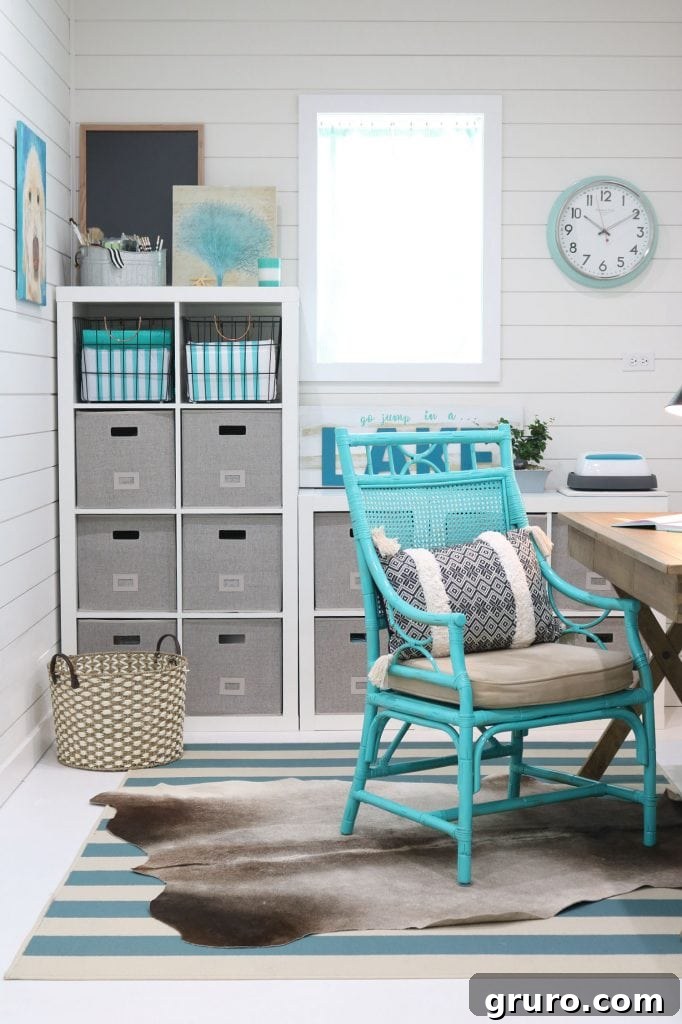 Cube storage in a small office with white paint and colorful accents creating a perfect home office