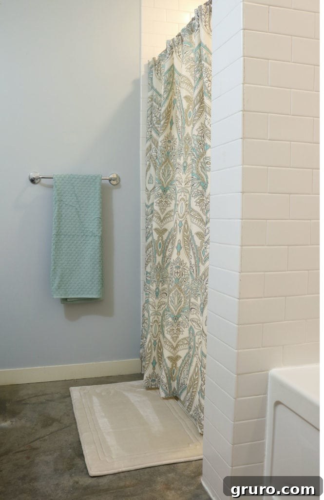 Adding vibrant color and pattern to a bathroom with a stylish shower curtain.