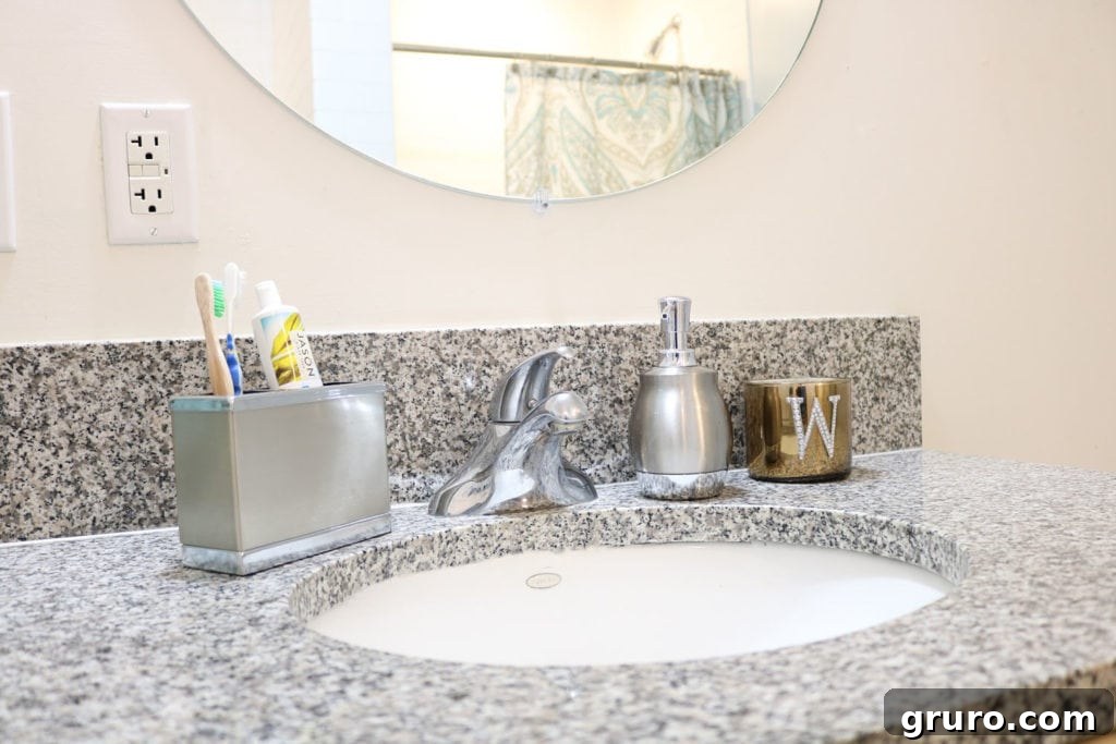 Minimal sink decor for a small bathroom in a condo, prioritizing cleanliness and space.