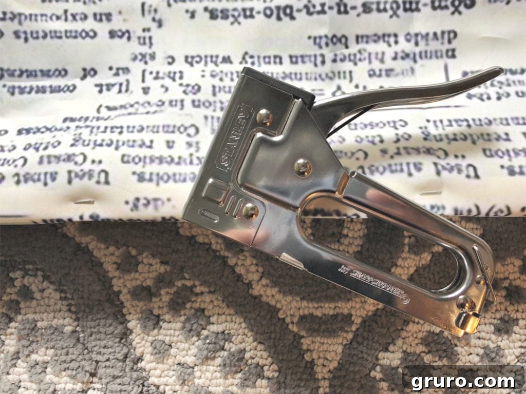 Stanley staple gun for making shower curtain art Staple shower curtain to frame using a regular Stanley staple gun, illustrating the process.