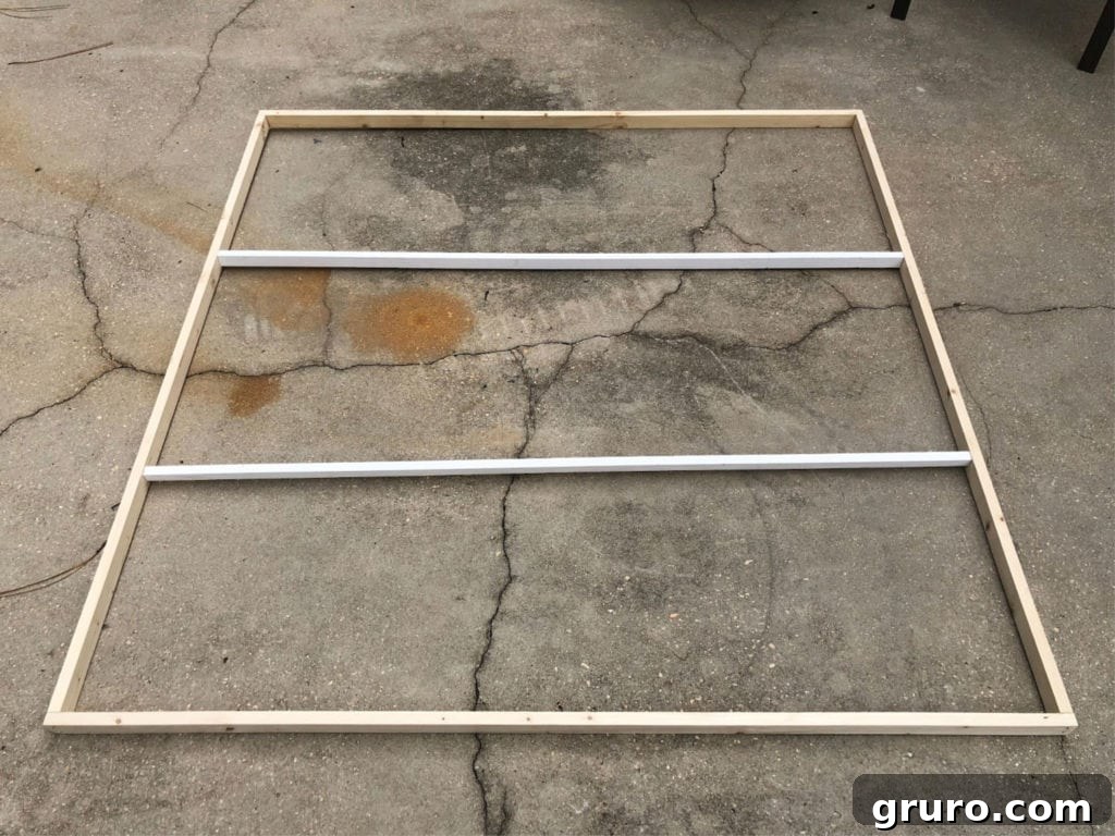 Creative Shower Curtain Wall Art Projects 2 Attach wood for frame with center support, highlighting stability for larger projects.
