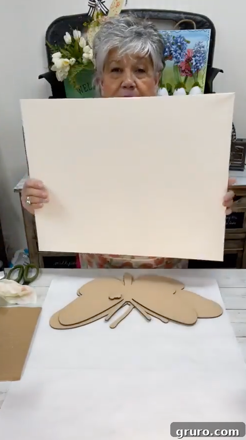 Preparing the canvas with brown paint for texture