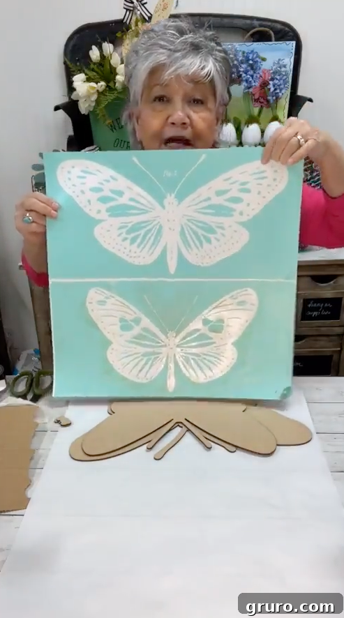 Applying white base coat to butterfly wood cutout