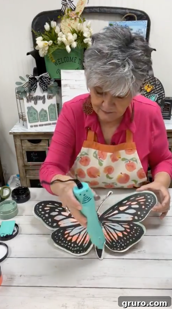 Final stenciled butterfly wood cutout after drying