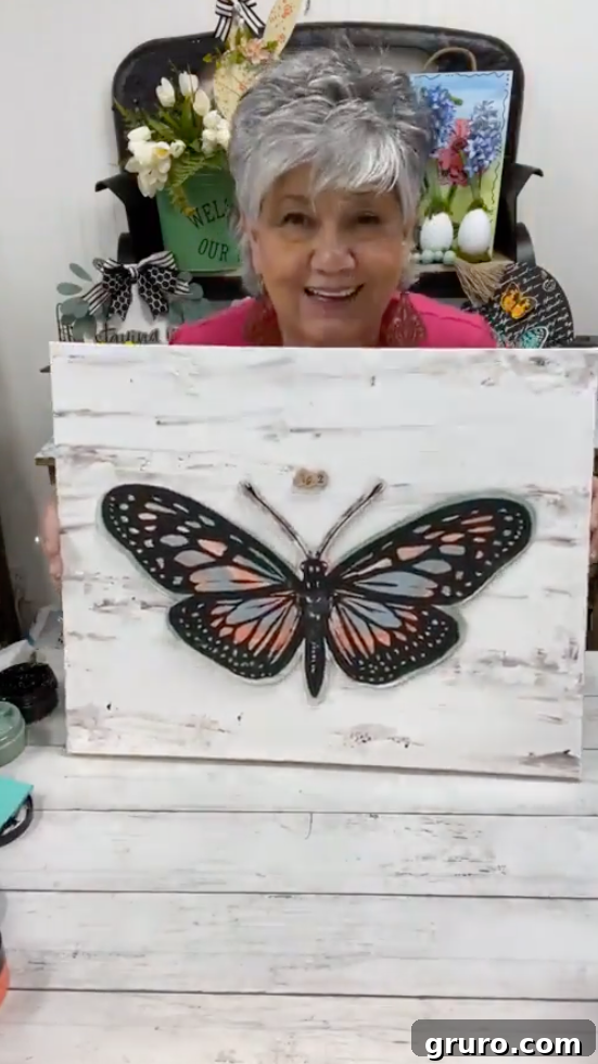 Carefully placing the butterfly onto the textured canvas