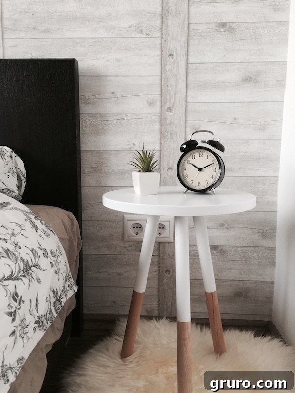 A modern farmhouse bedroom with white walls, rustic wooden details, and layered textures