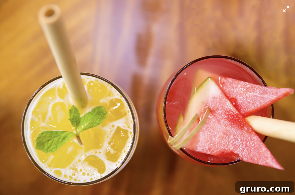 7 Essential Summer Refreshers for Lively Socials 2 Fresh Mango Mojito cocktail in a glass with mint and lime.