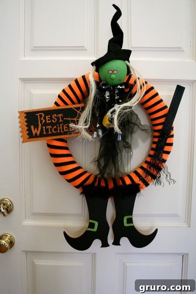 Another perspective of the enchanting 'Best Witches' Halloween wreath, highlighting the witch's intensely captivating eyes and overall whimsical design
