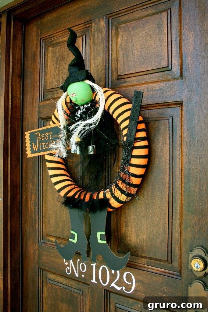 A vibrant and fun 'Best Witches' Halloween wreath, featuring witch boots and a witch figure, perfect as a welcoming front door decoration