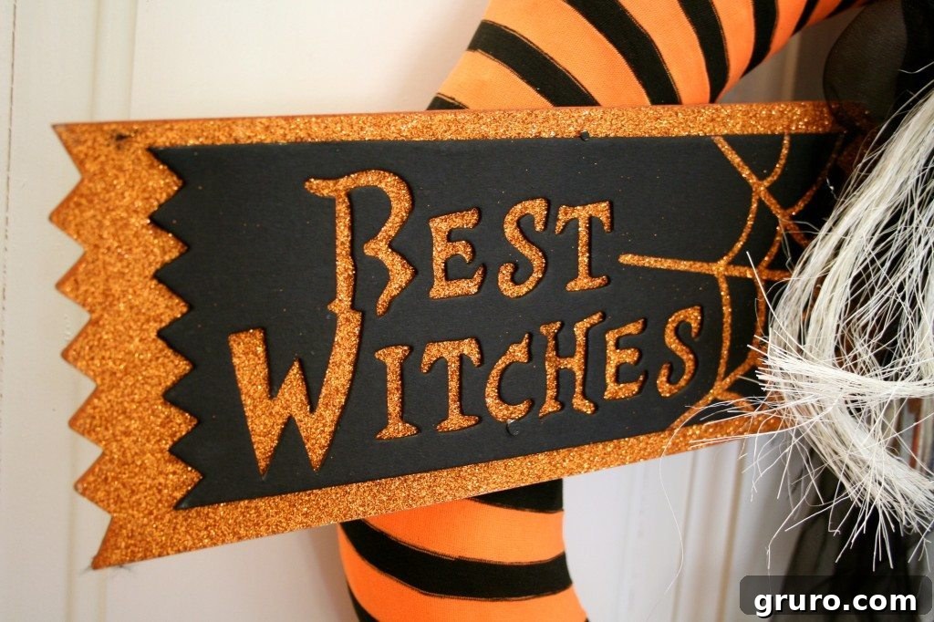 The fully assembled 'Best Witches' Halloween wreath featuring witch boots and a witch figure, beautifully arranged and ready for display