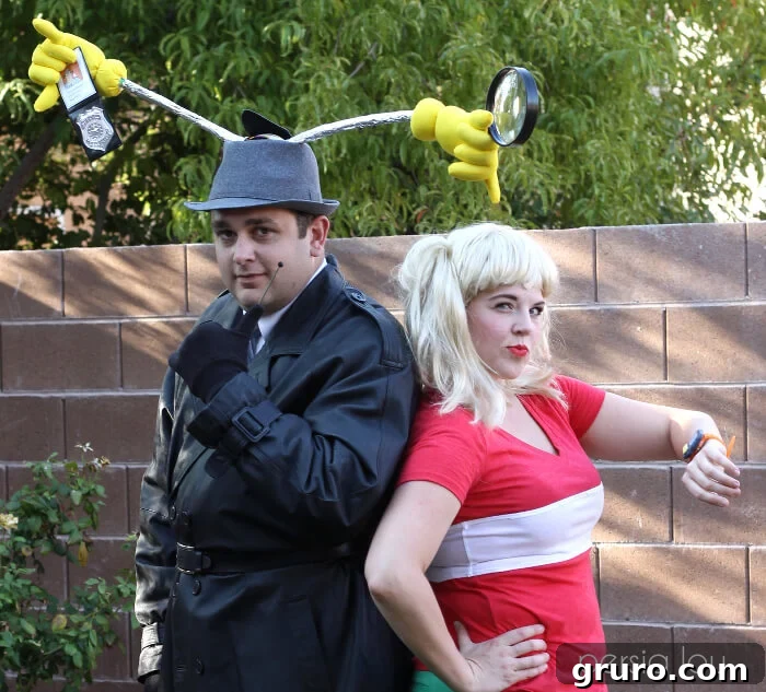 A couple dressed as Inspector Gadget and Penny, featuring Gadget's trench coat and hat, and Penny's signature look.
