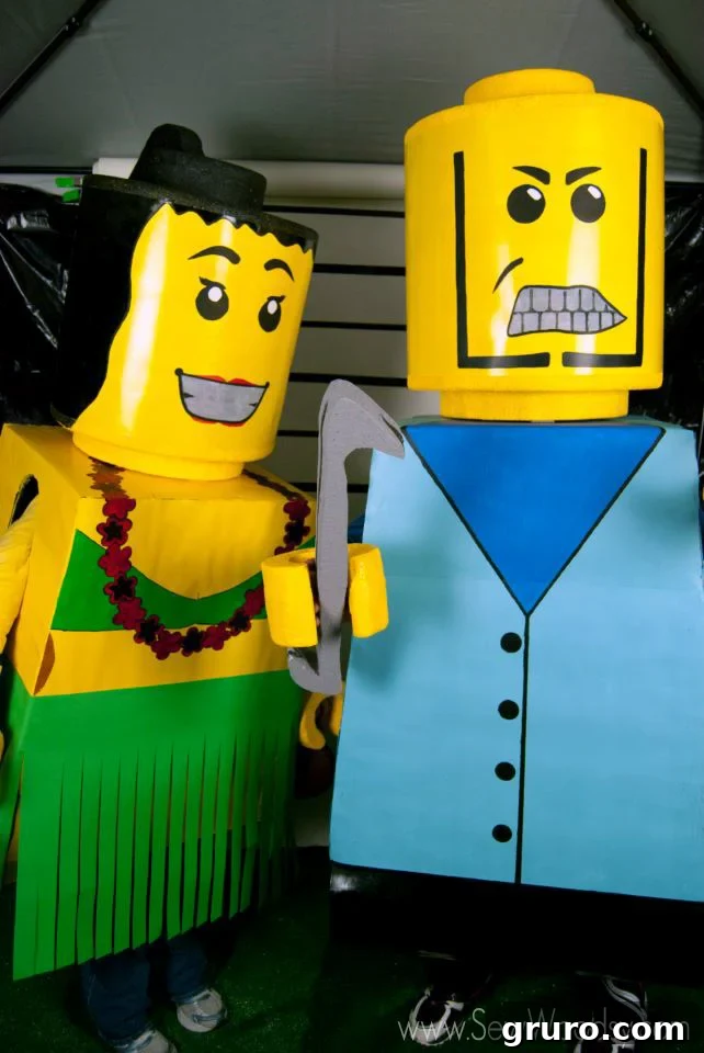 A couple dressed as colorful LEGO bricks, showing off their creative and fun DIY costumes.