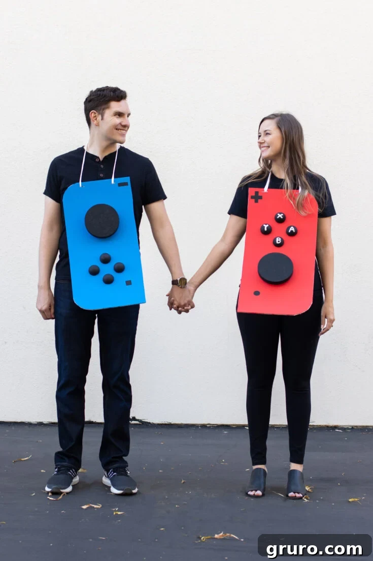 A couple dressed as a DIY Nintendo Switch console, with each person representing one of the Joy-Con controllers.
