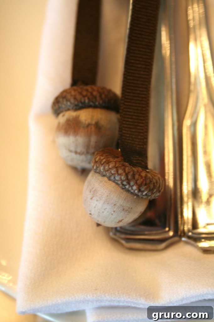 Acorn and ribbon napkin ring for a natural Thanksgiving look DIY napkin ring made from an acorn hot-glued to a ribbon