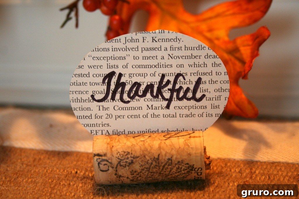 Personalized chalkboard place card for Thanksgiving Chalkboard paper place card with a handwritten Thanksgiving message in a cork holder