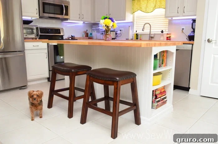 Beautifully updated kitchen island with butcher block and charming decor, including a dog