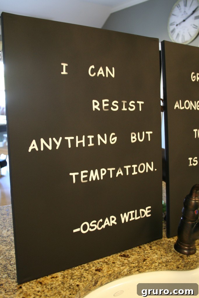 Completed spray-painted canvas art with the stickers removed, revealing the negative space quote.