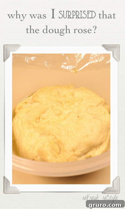 Closeup of focaccia dough being prepared, possibly dimpled with fingers