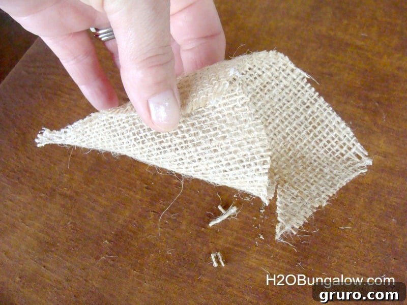 Image demonstrating how to trim the edges of the snowman's hat for a proper fit on the styrofoam ball.