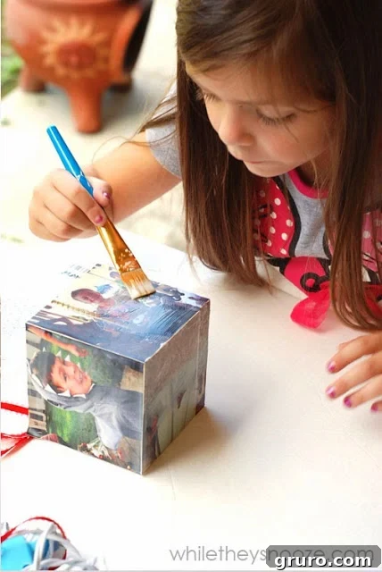 The Instagram Time Capsule Ornament drying after Mod Podge application, showing the smooth, clear finish.