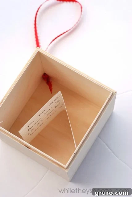 Filling the Instagram Time Capsule Ornament with small mementos and a handwritten note.