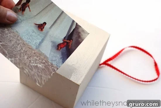 Applying an Instagram photo to the wooden box with Mod Podge for the time capsule ornament.
