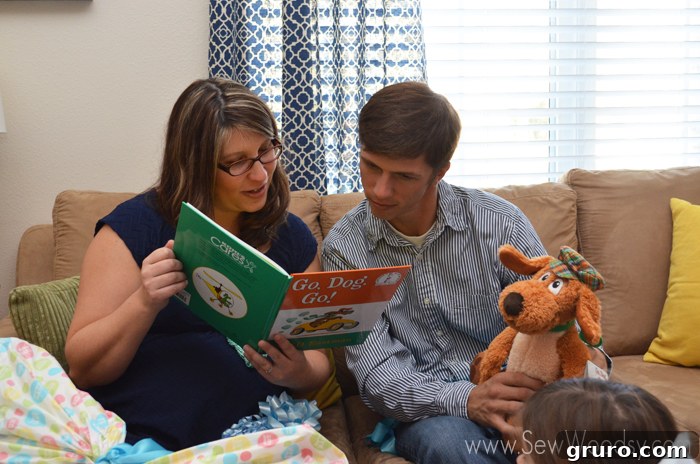 Reading messages in books received at a baby shower