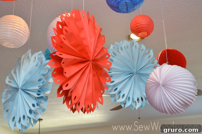 Aqua and red hanging decorations for a nautical baby shower