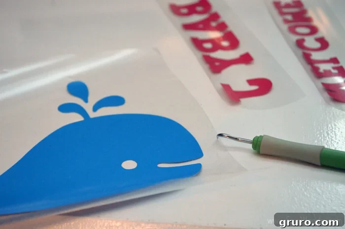 Weeding Iron-On Vinyl for a DIY Baby Shower Flag