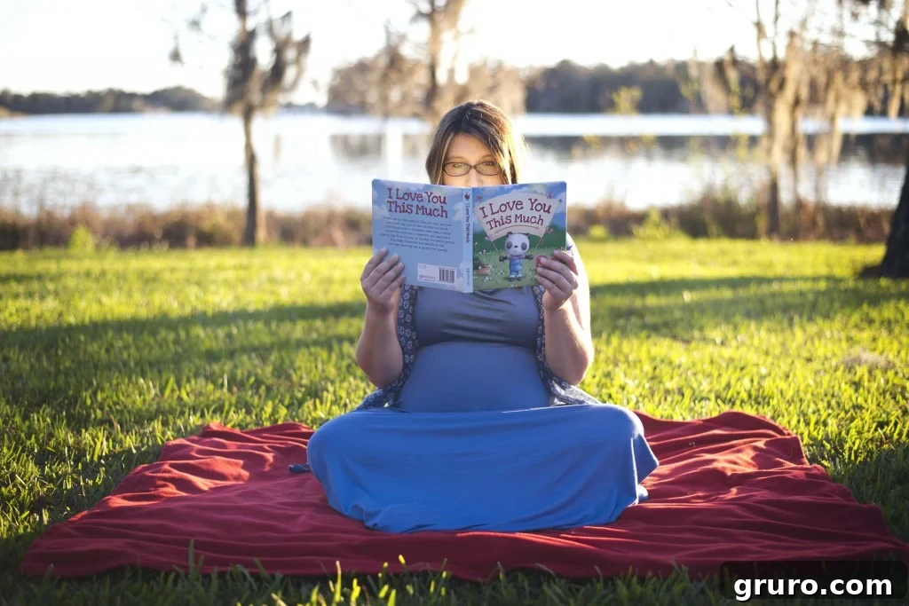 Glowing expectant mother holding a book, soft focus maternity portrait