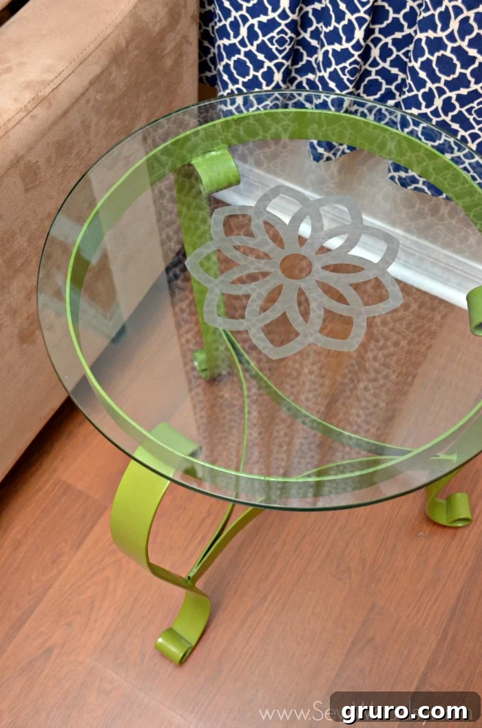 Close-up of the completed etched floral design on the glass tabletop