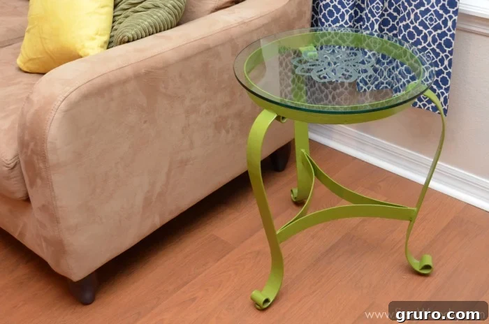 The newly upcycled glass end table with its elegant etched design, now a stylish and functional piece of home decor.