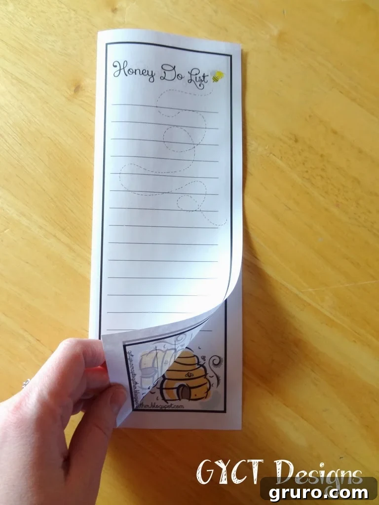 Image showing the Honey Do List printed out and ready for use, possibly on a desk.
