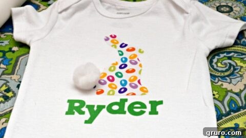 A DIY Easter Bunny onesie with a personalized name, a perfect gift for a baby's first Easter.