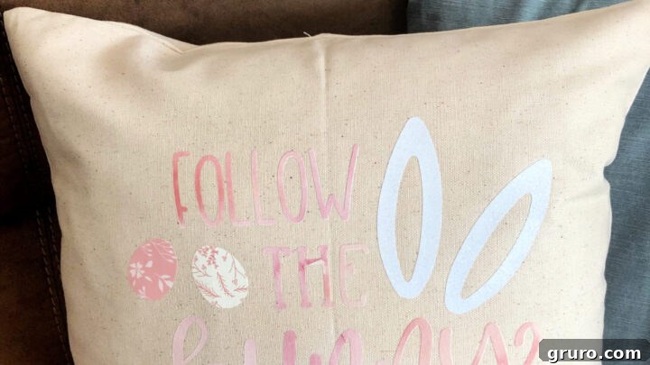 A cute DIY 'Follow the Bunny' pillow cover featuring bunny footprints and a playful design.