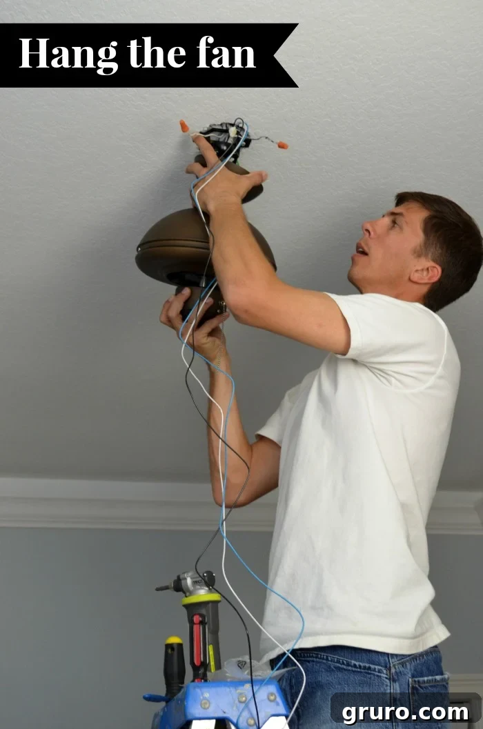 Ceiling Fan Installation: From Box to Breeze 6 Secure the downrod with a cross pin and cotter pin, tighten set screws, and slide the yoke cover into place.
