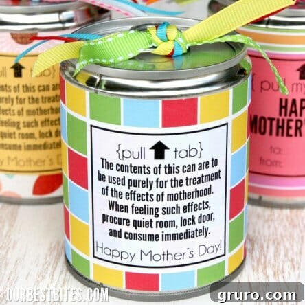 Decorated tin cans filled with various sweet treats, creatively packaged for Mother's Day or Teacher Appreciation gifts.