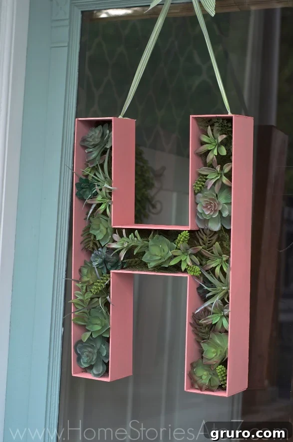 A stylish 3D wood letter monogram serving as a unique wreath alternative, adding a personalized touch to a front door or wall.