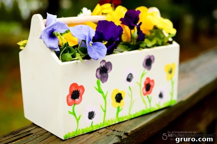 A vibrant flower pot adorned with colorful thumbprint flowers, created by children as a sweet and personal Mother's Day gift.