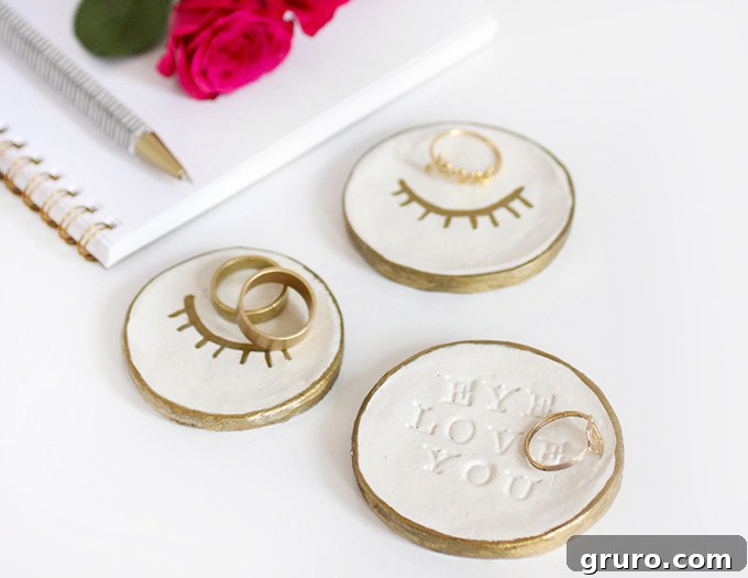 A stylish air-dry clay ring dish, possibly with a unique design or metallic accent, perfect for holding jewelry on a dresser or nightstand.