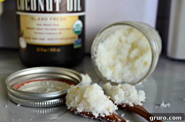 A jar of homemade vanilla sugar scrub with a spoon, promising a luxurious and relaxing spa experience, perfect for a Mother's Day gift.